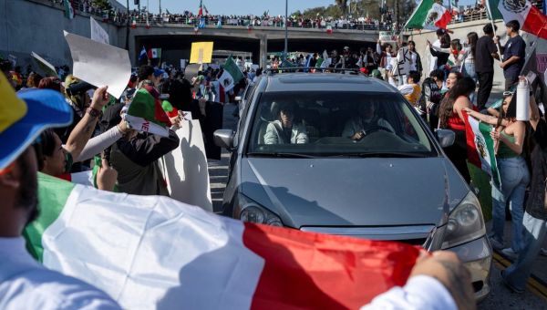 Demonstrators opposing Trump’s immigration crackdown block traffic in Los Angeles