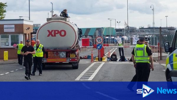 Climate protestors block entrances to two major oil refineries