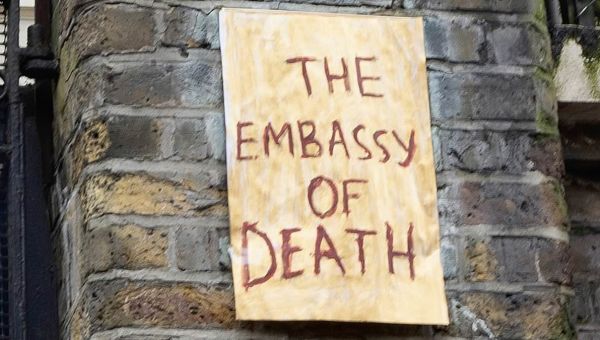 Protesters stick ‘Embassy of Death’ sign in front of Russian Embassy