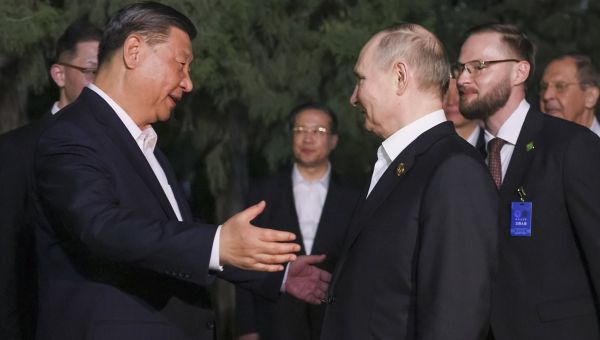 Putin and Xi’s bromance continues as Chinese leader HUGS Vladimir