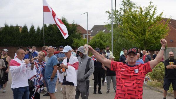 Activists with beer begin protest outside migrant hotel in Rotherham
