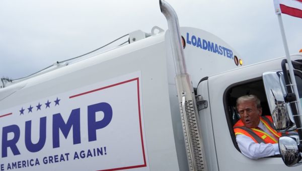 Trump highlights Biden’s ‘garbage’ comments by sitting in trash truck