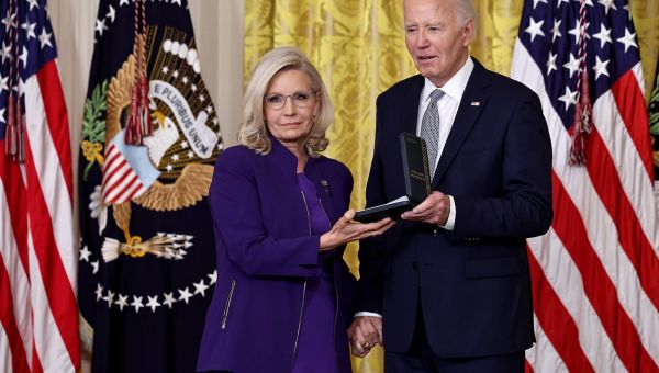Awkward moment Biden grips onto Liz Cheney’s hand and doesn’t let go