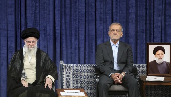 Reformist formally takes over as Iran’s president after supreme leader offers endorsement