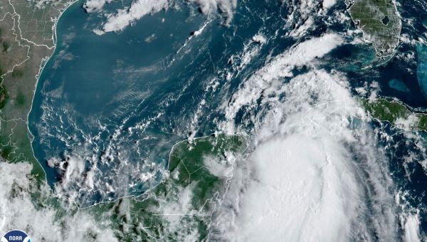 Idalia strengthens into a hurricane as it advances toward Florida with life-threatening storm surges