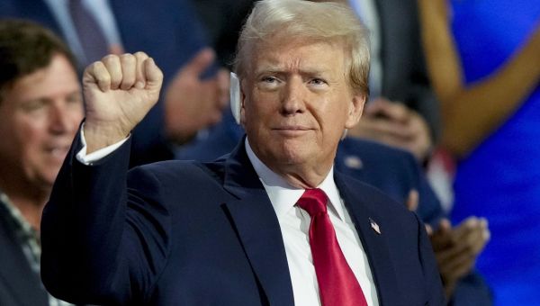Trump surprises convention with bandaged cameo