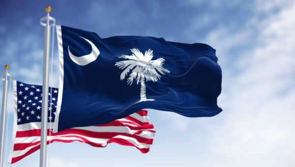 Why are flags flying at half-staff in SC Tuesday?