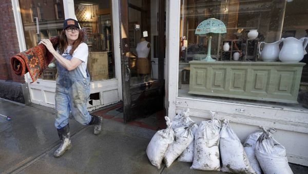 With historic floods receding, Vermonters shift to shoveling out tons of mud and debris