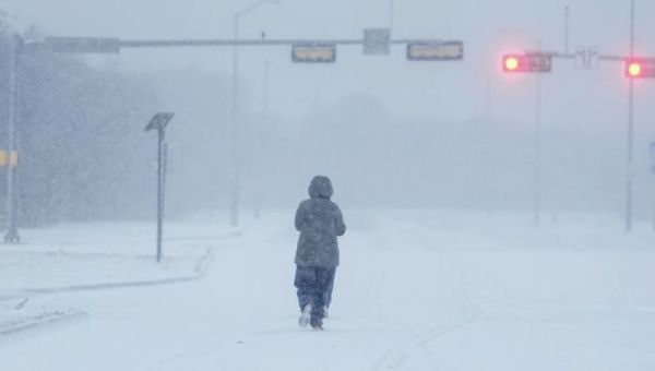 Schools stay shut and flights are grounded as dangerously cold wind chills blast much of the US