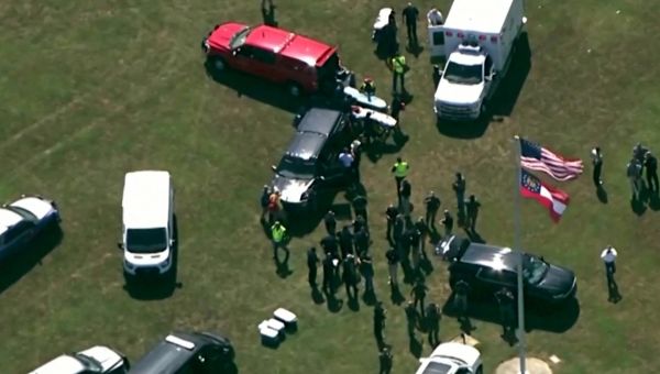 New panic buttons hidden on teachers prevented more carnage as gunman shot 13