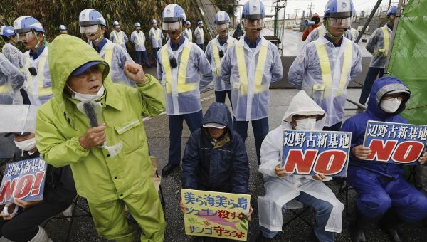 A Japan court orders Okinawa to approve a modified plan to build runways for U.S. Marine Corps