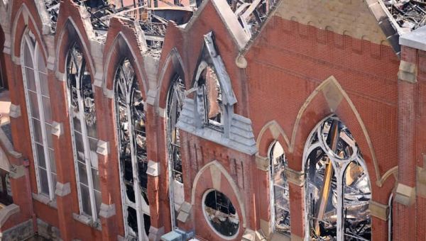 Where and when will First Baptist Dallas hold its Sunday service after Friday's fire?