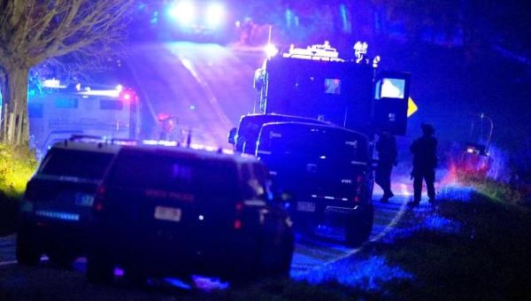 Authorities scour woods, water and homes on Day 2 of search for suspect in Maine mass shooting