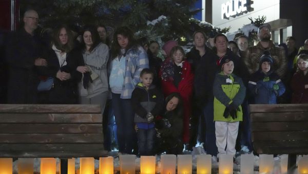 A shaken Minnesota community waits for answers on the killings of 2 officers and 1 firefighter