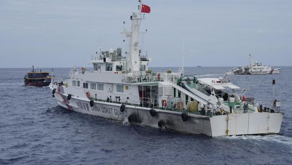 Philippine coast guard says it removed barrier placed by China’s coast guard in disputed shoal