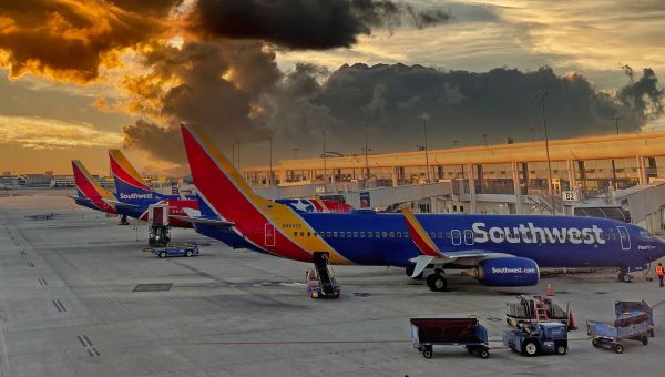 Southwest Airlines passenger opens plane's emergency door, jumps onto wing