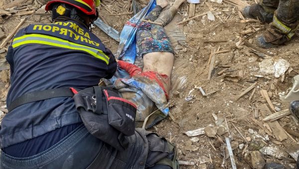 Distressing picture shows boy in pyjamas being pulled from Putin bomb wreckage