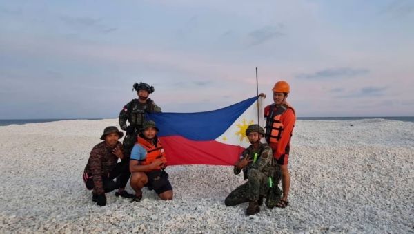 China, Philippines raise rival flags on disputed South China Sea sandbank