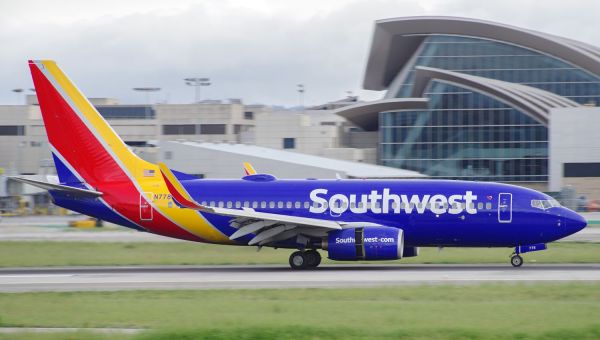 Southwest Passenger Taken to Hospital After Opening Emergency Exit and Climbing onto Plane Wing