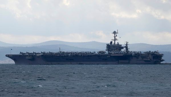 Fighter jet slips off carrier hangar deck in Red Sea, one minor injury