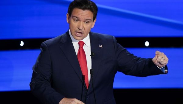 WATCH: Climate Protester Finds Out It's Bad Idea to Rush a Stage With Ron DeSantis on It