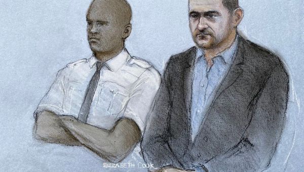 Tommy Robinson jailed for 18 months for repeating libellous claim against refugee