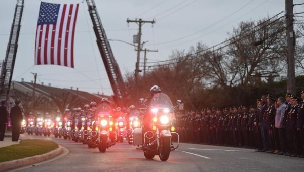 NYPD Officer Jonathan Diller, of Massapequa, engaged in a tug-of-war with alleged shooter Guy Rivera, police official said