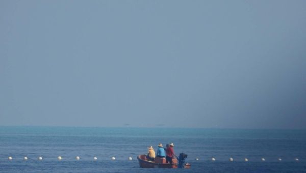 Philippines says it will remove barrier installed by China in disputed South China Sea