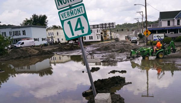 Flooded New England communities shift to recovery, shoveling out mud and debris