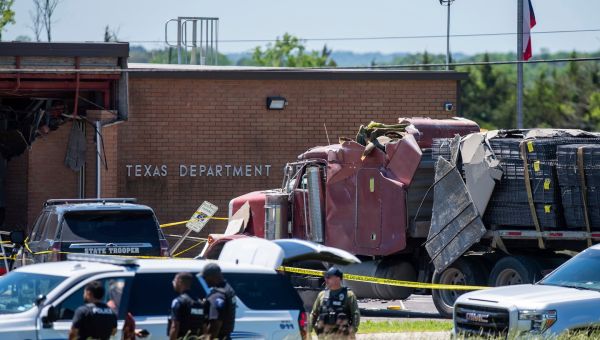1 killed, 13 hurt after driver rams truck into Tex. state agency, officials say