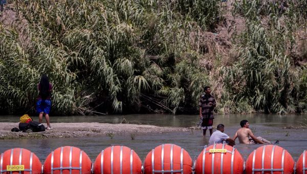 Judge orders Texas to remove floating barriers aimed at discouraging migrants from entering US