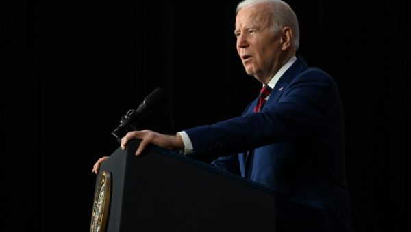 Biden mourns with mass shooting survivors, tightens gun law