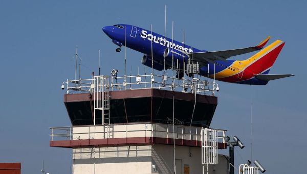 Southwest Airlines passenger opens emergency exit door, climbs onto wing in New Orleans