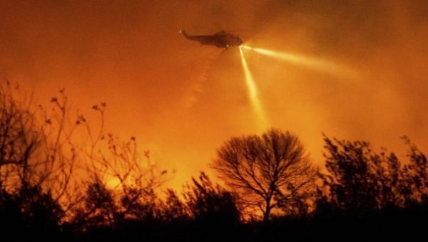 Firefighters deploy as strong winds threaten more LA neighborhoods