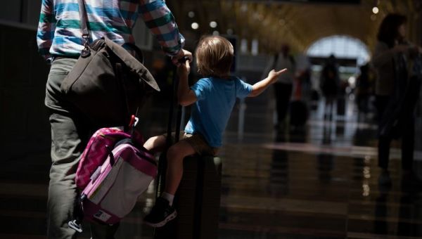 Biden administration proposes new rule banning airlines from charging parents extra fees to have their kids seated next to them | CNN Business
