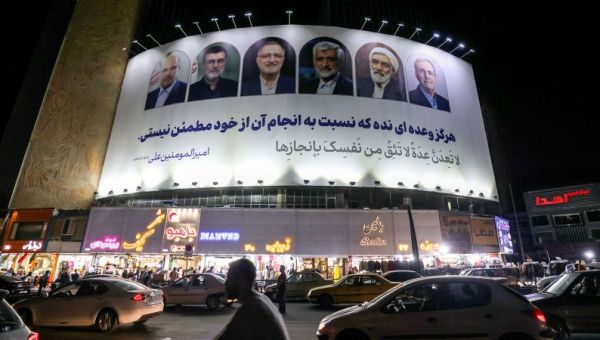 Iranians vote for a new president under the shadow of conflict and economic woes