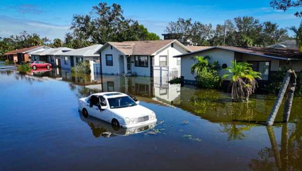 Floridians return home to clean up from two hurricanes with gas and power in short supply