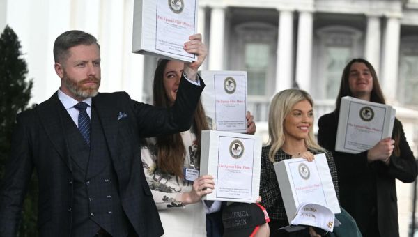 Right-wing influencers get binders labeled “The Epstein Files,” but downplay revelations