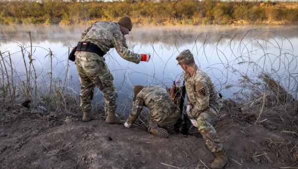Greg Abbott’s armed troops block border patrol
