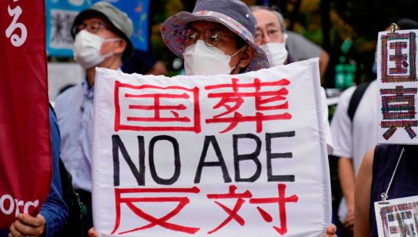 Protesters march on Japan’s parliament to criticise Shinzo Abe’s state funeral