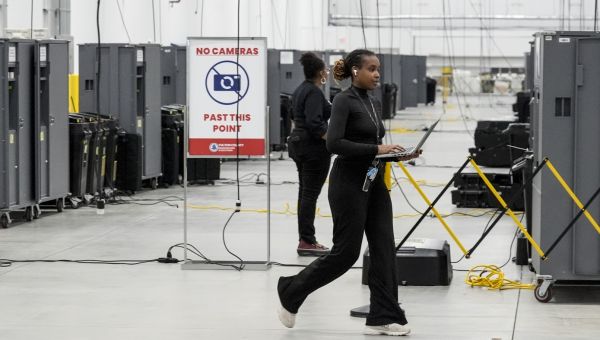 Hours are extended for certain Georgia polling places after threats