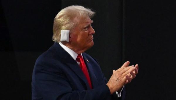 Trump appears emotional as he enters Republican convention with bandaged ear