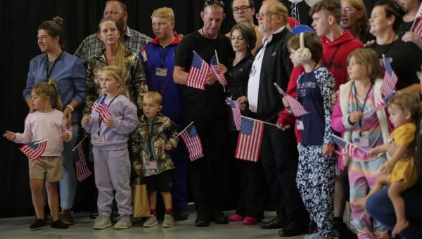 White South African refugees welcomed by Trump admin as they arrive in US