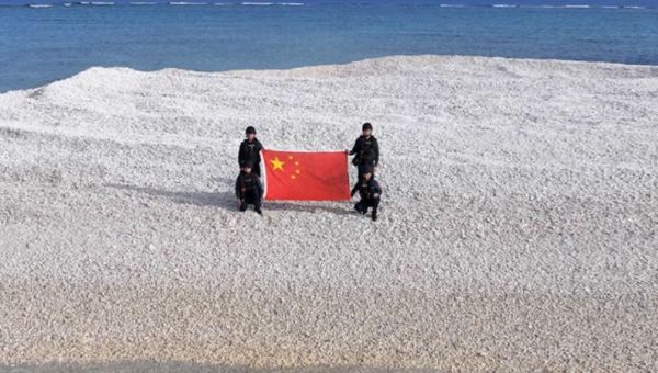 China and Philippines unfurl competing flags on disputed South China Sea sandbars, reviving tensions