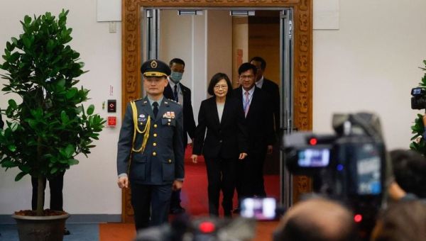 Taiwan president heads to U.S., China warns against meetings
