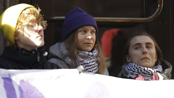 Climate activists including Greta Thunberg block entrance to the…