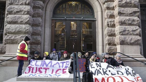 Climate activists including Greta Thunberg block entrance to…