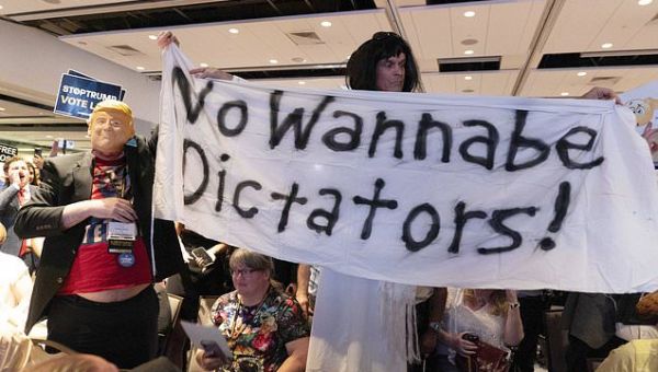 Donald Trump confronts repeated booing during Libertarian…