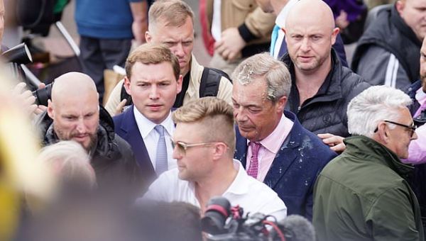 Farage flanked by fans but swilled with milkshake as Clacton…