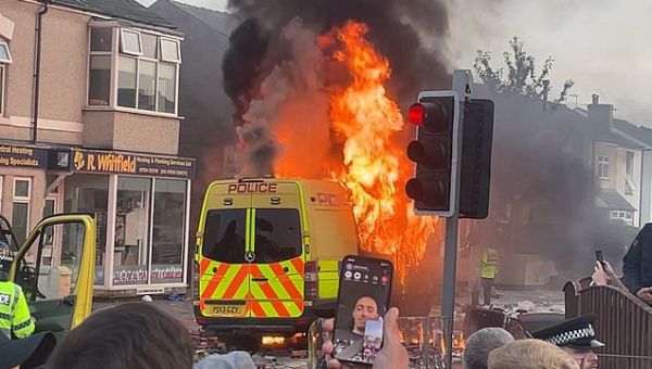 Violent clashes between protesters and police in Southport...